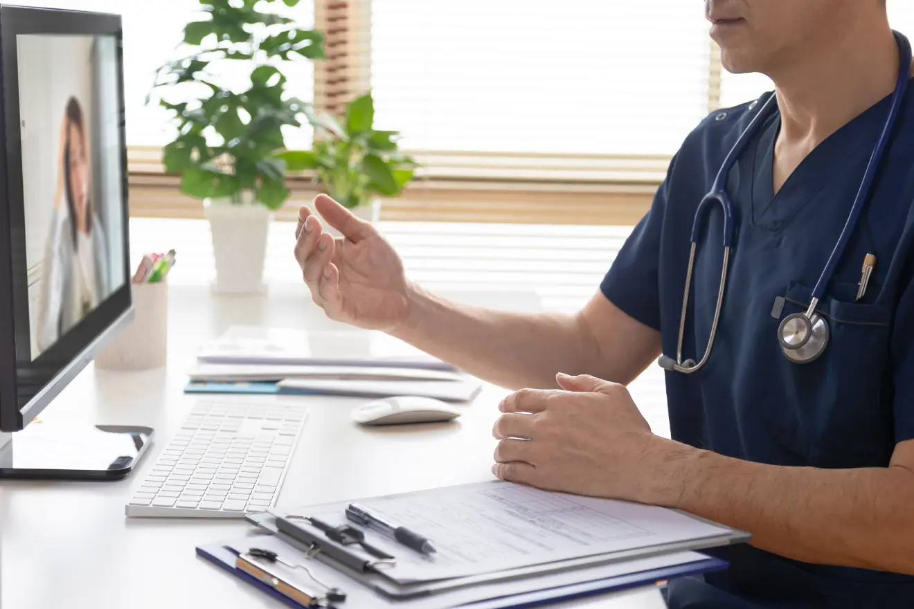 Online video physiotherapy consultation on a laptop